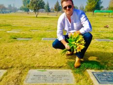Stephen McPhilemy laying grave of his clan member and Donegal native, Father William McGinley. Buried in Bakersfield, California; far from his beloved birthplace - Donegal, Ireland